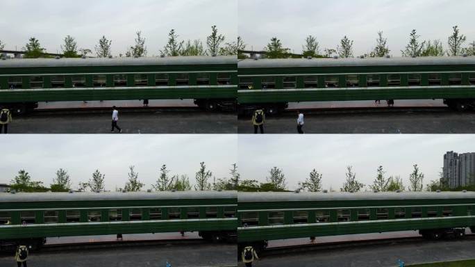 航拍城市公园停放的绿皮火车车厢景观