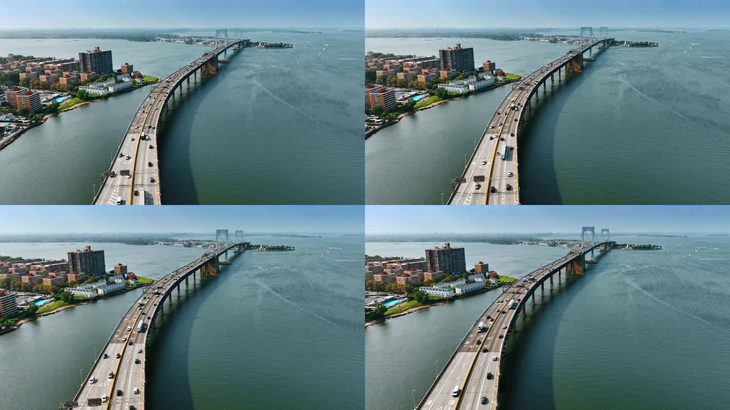 令人惊叹的纽约悬索桥。无人机拍摄的桥上六车道的道路上有来往的汽车。