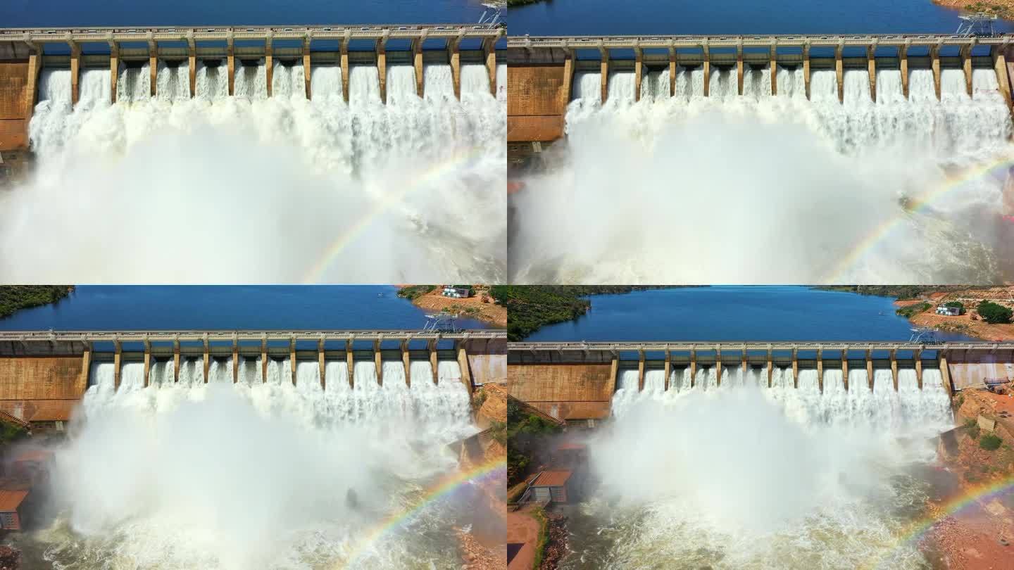 无人机、水坝和自然彩虹湖水，用于可持续电力、可再生能源或电力生产。水电，桥梁或鸟瞰图的河流，瀑布或闸