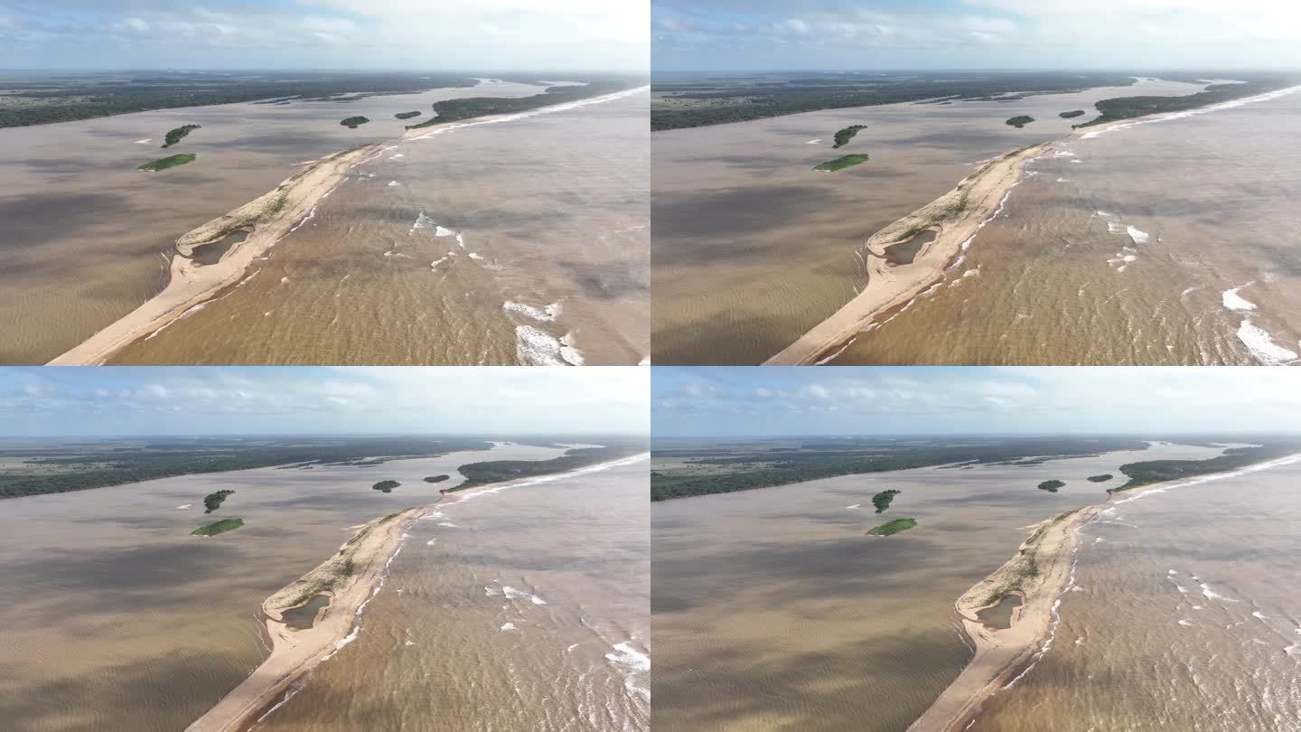 航拍图左侧的云层阴影在多塞河河口的水域，巴西