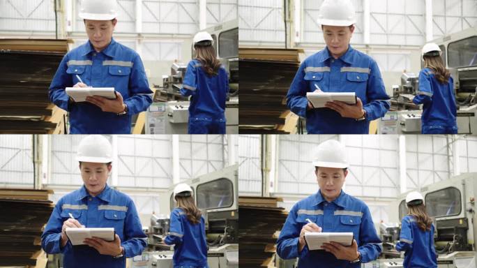 制造工厂纸板造纸厂工业工程师检查大型机器输送纸生产线