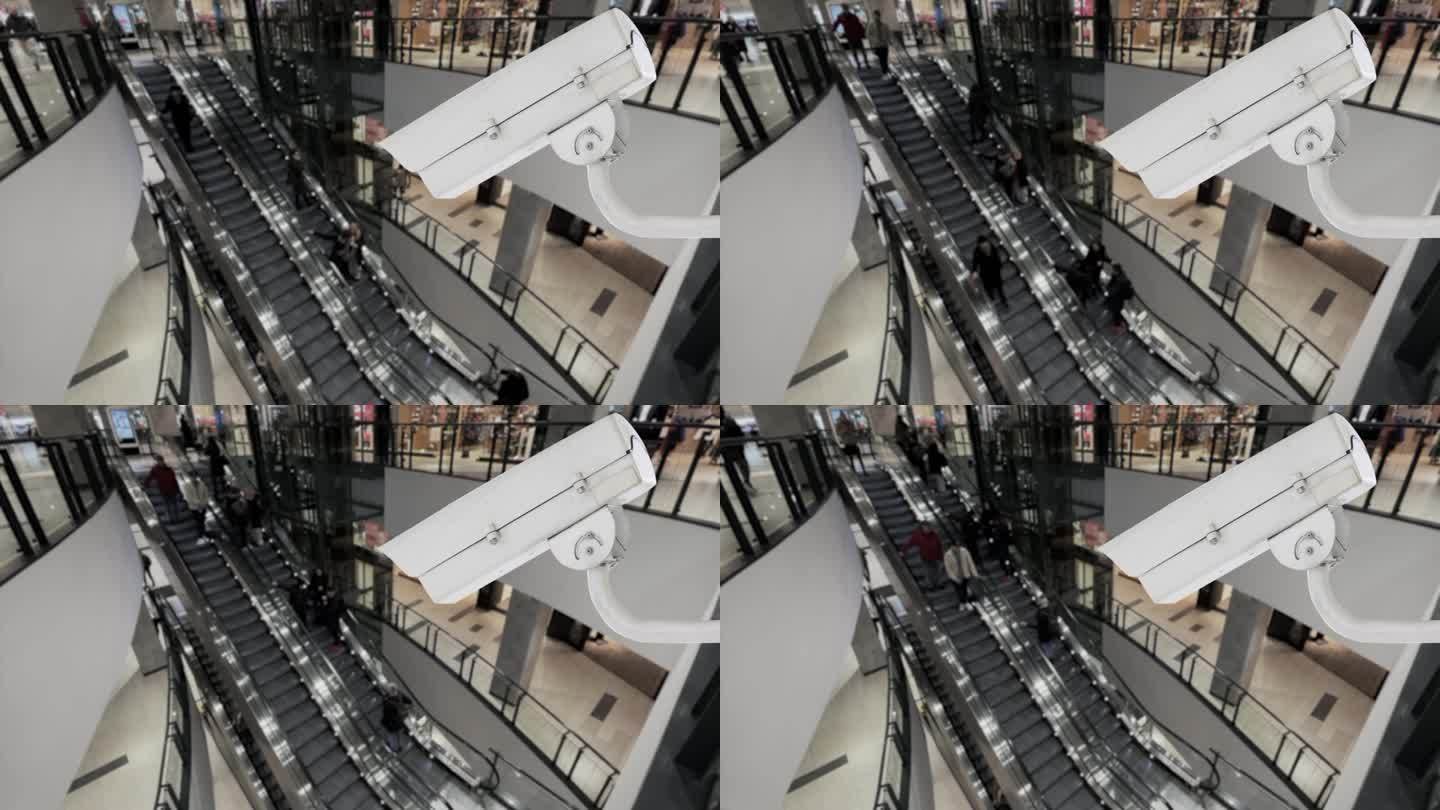 购物中心拥挤的公共场所的闭路电视摄像头。安装在机场或火车站自动扶梯附近的背景模糊的安全视频监控摄像头