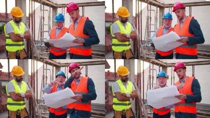 施工队在建筑工地讨论工程