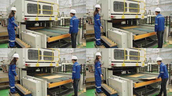 制造工厂纸板造纸厂工业工程师检查大型机器输送纸生产线