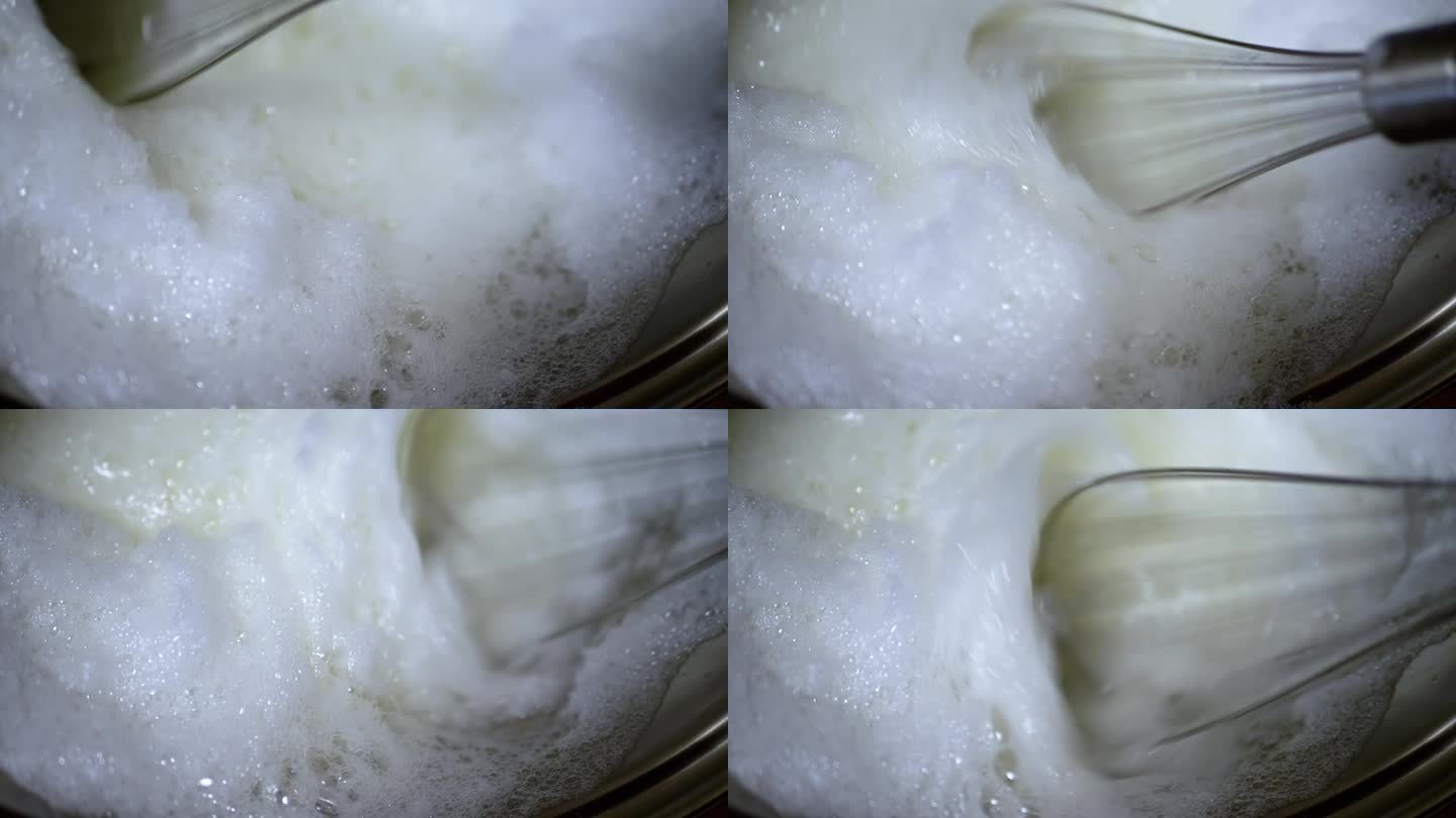 近距离，用打蛋器把生鸡蛋打成蓬松的白色泡沫