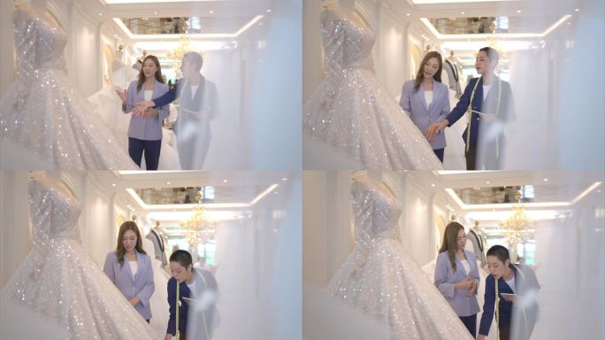 两位亚洲时装设计师都在婚纱店设计婚纱