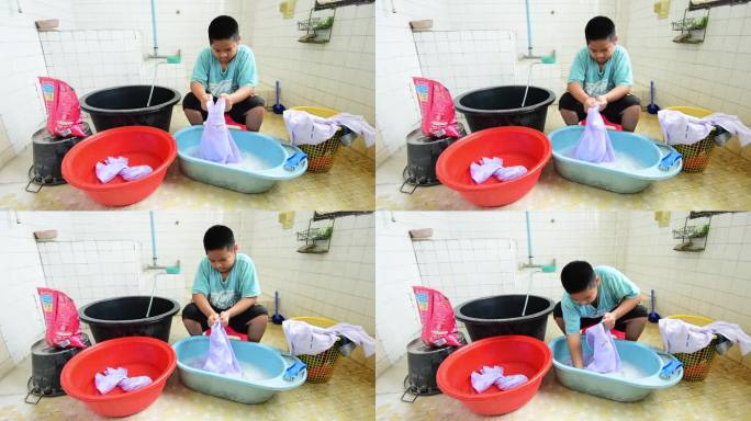 亚洲男孩在洗衣服，穿校服