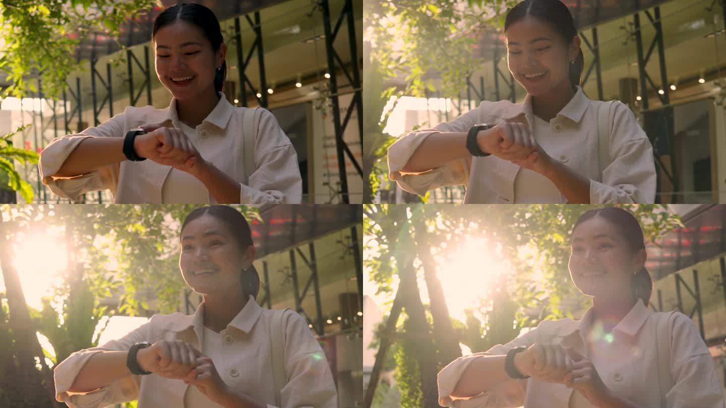 超级慢动作的年轻亚洲女人带着智能手表。