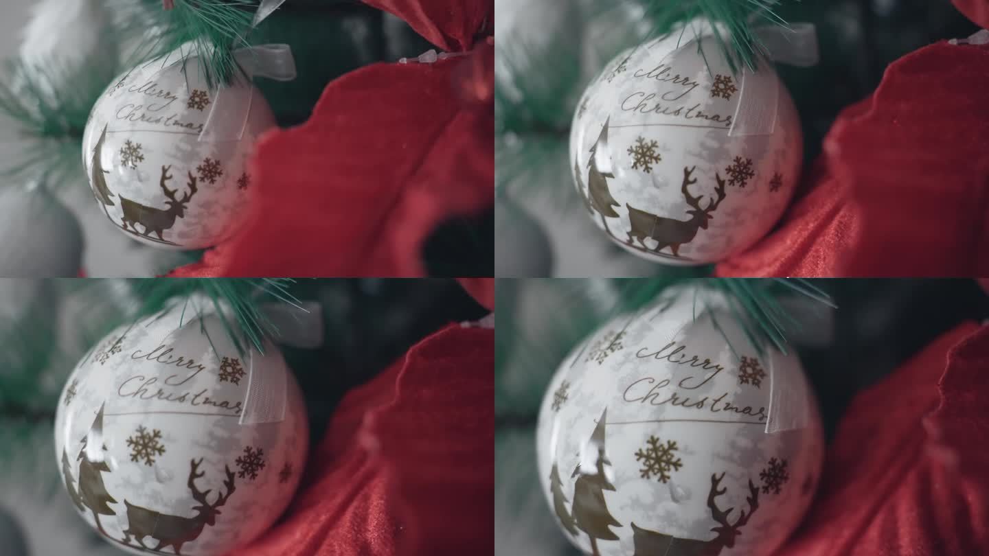 特写的银色圣诞装饰球上挂着圣诞快乐的祝福语和驯鹿，节日快乐的寒假