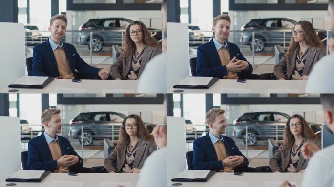 年轻的白人夫妇在签订合同后与汽车推销员聊天