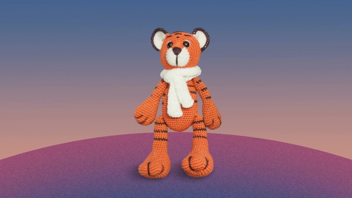 一个可爱的小老虎玩具在旋转的星球上行走。手工填充针织玩具动画