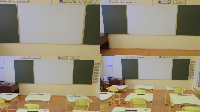 一个绿色的书写和画板在空椅子前准备好了，邀请创造性的学习。学校的教室已经准备好迎接学生:空旷的派对体