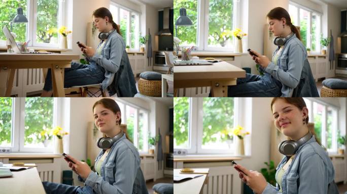一个十几岁的女孩坐在书桌前使用智能手机的肖像