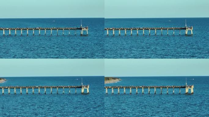 许多游客在威尼斯钓鱼码头享受假期的鸟瞰图。海滨夏日活动