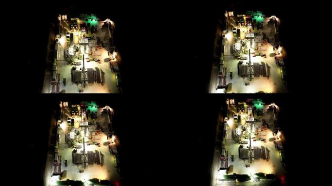 石油和天然气钻井站在夜间的俯视图-无人机拍摄