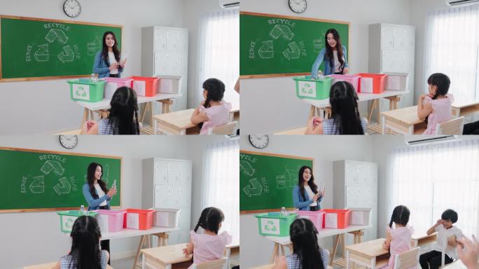 女教师正在给学生上课，教他们如何选择和分类垃圾进行回收。小学生在教室里拿着可回收的垃圾