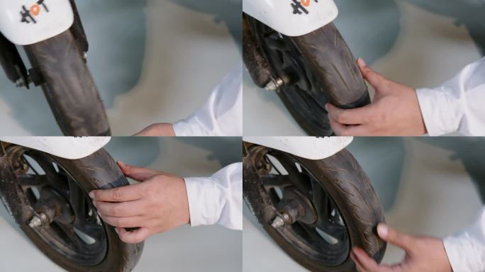 电动自行车 车轮胎检测特写 手捏轮胎