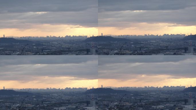 日本，大阪:夕阳下的大阪市全景。