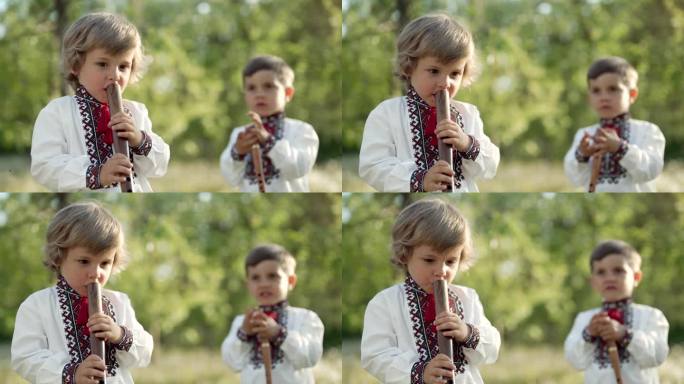小男孩们在户外演奏木管木笛-乌克兰索皮卡。民间音乐概念。乐器。孩子们穿着传统的刺绣衬衫。
