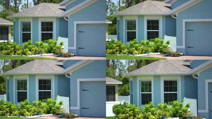 佛罗里达州南部普通私人住宅的正面视图。单户住宅，双车库门和宽车道