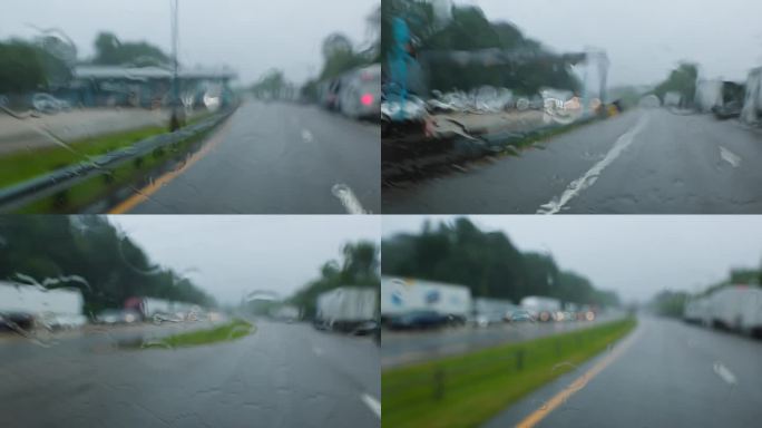 由于大雨，桥隧道路上的水位上升:在弗吉尼亚州的暴风雨中行驶的汽车。驾驶牌照，POV汽车司机