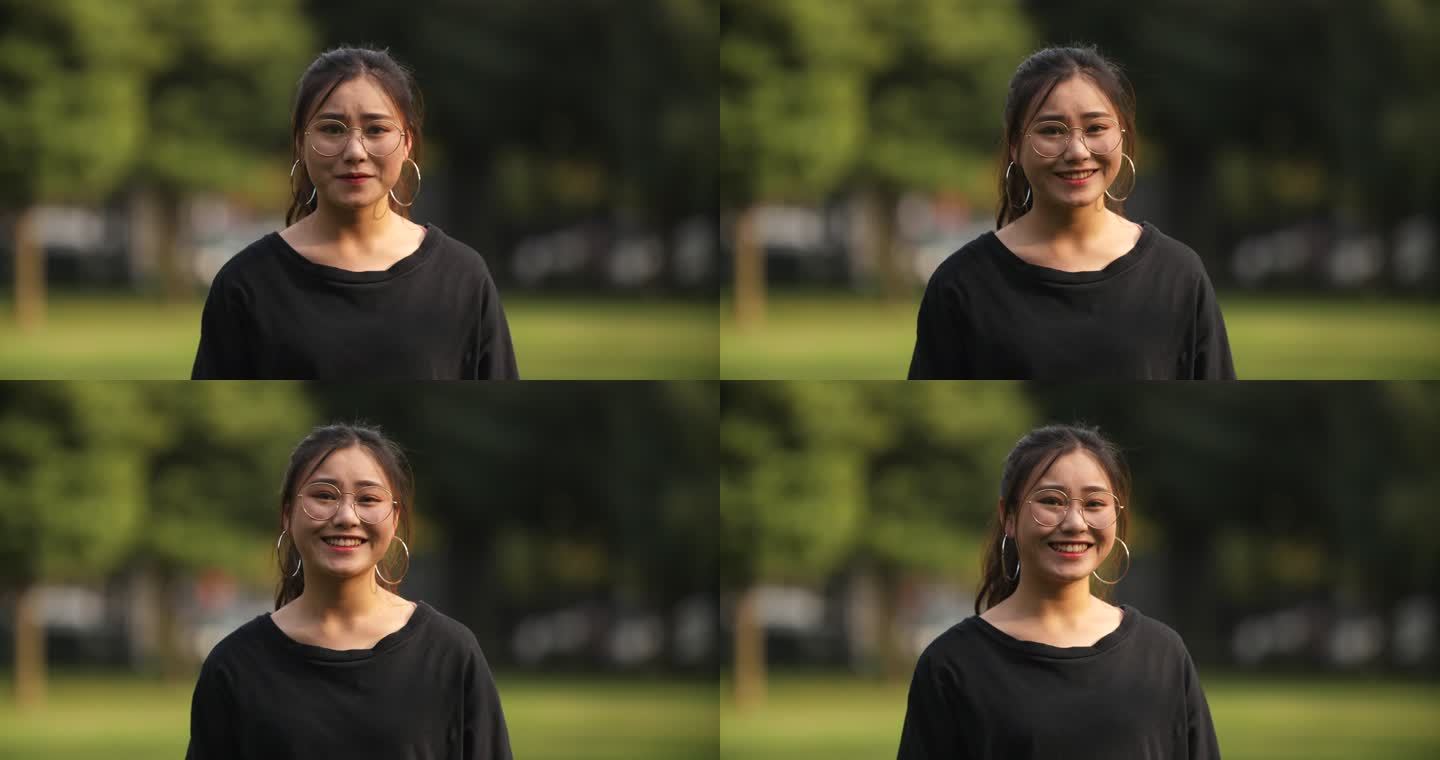 一位戴眼镜的女大学生看镜头微笑的肖像