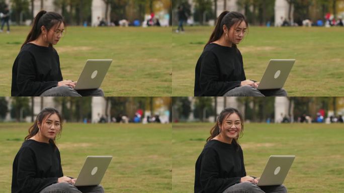 秋天校园女大学生坐在草地滑板上用电脑学习