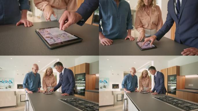 房地产经纪人向一对正在看豪宅的夫妇展示一本电子平板电脑上的小册子