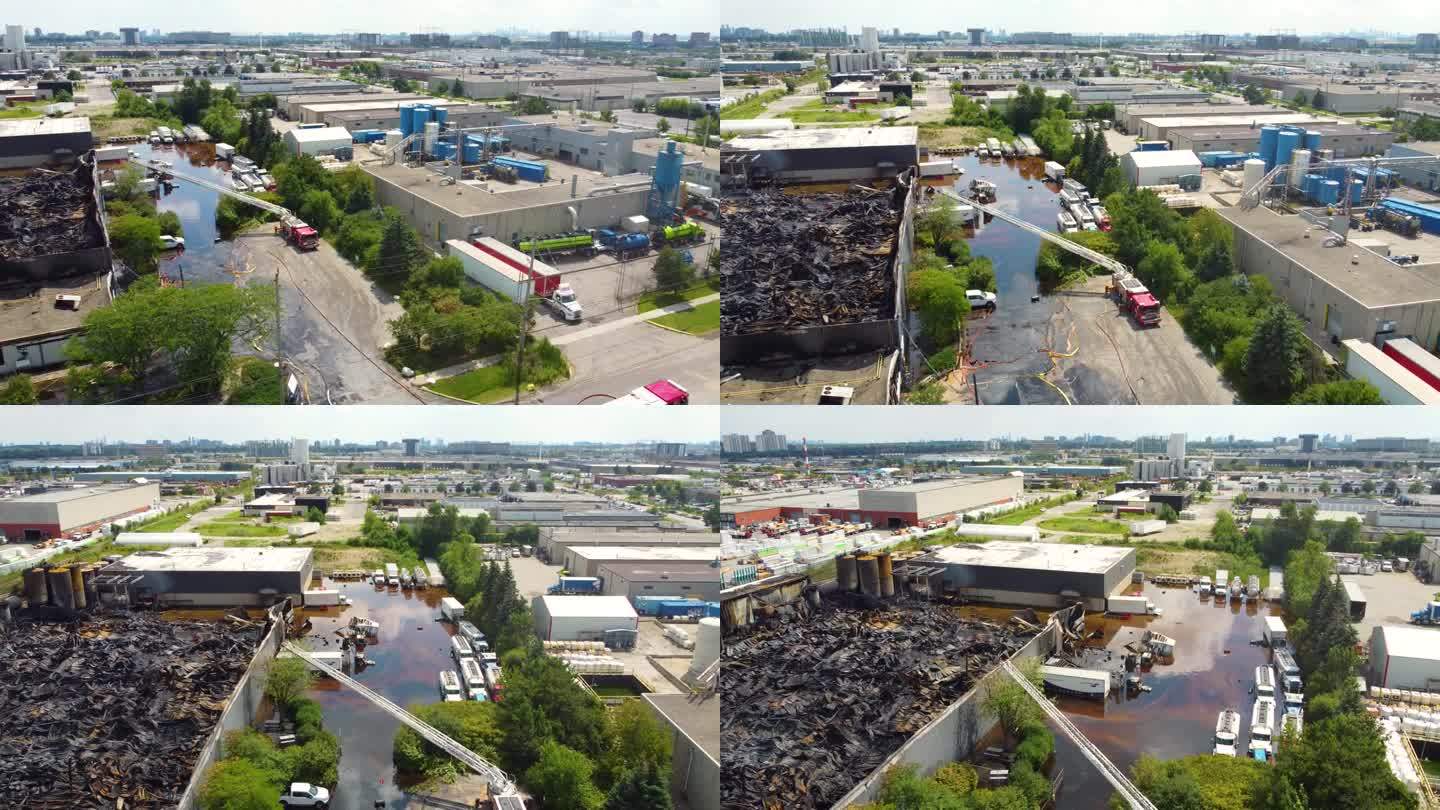 加拿大多伦多被烧毁的工业厂房附近的街道上的消防车。——空中