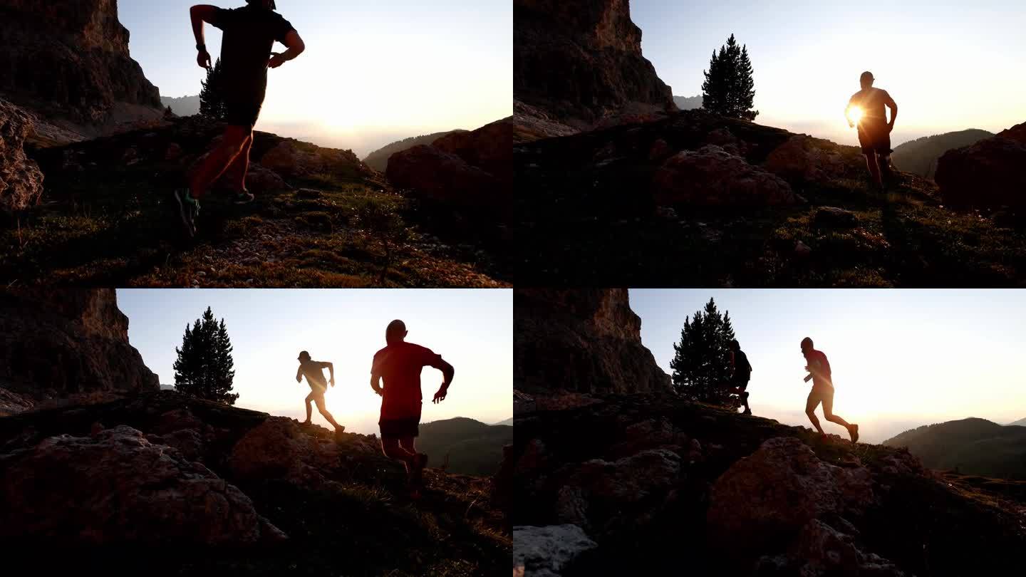 日落时分，两个人在山上跑步