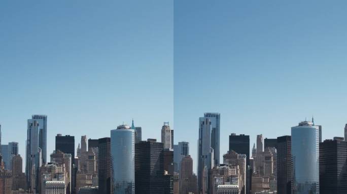 垂直屏幕:曼哈顿建筑鸟瞰图。从直升机上拍摄华尔街金融区全景。哈德逊河水运办公楼景观