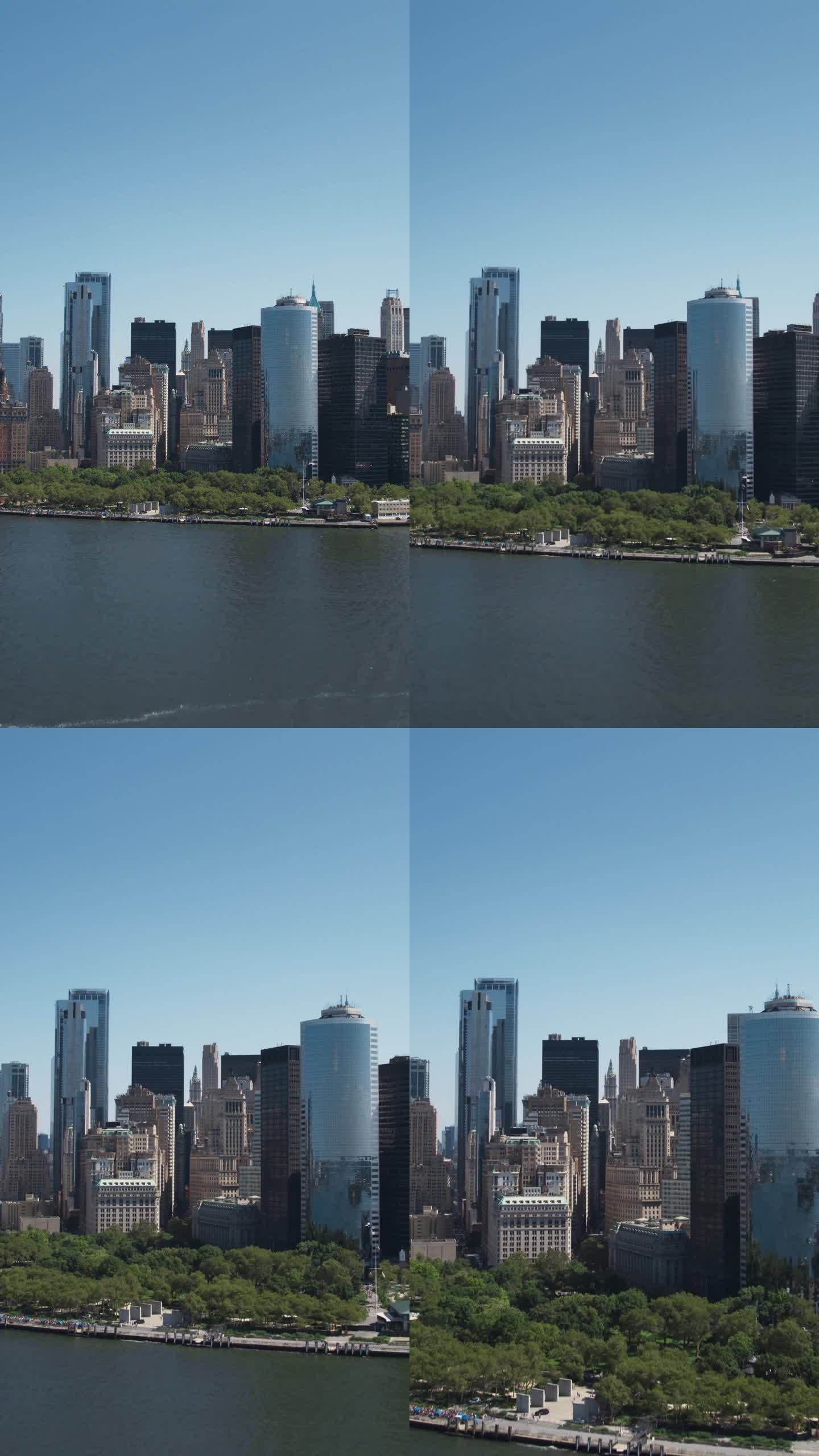 垂直屏幕:曼哈顿建筑鸟瞰图。从直升机上拍摄华尔街金融区全景。哈德逊河水运办公楼景观