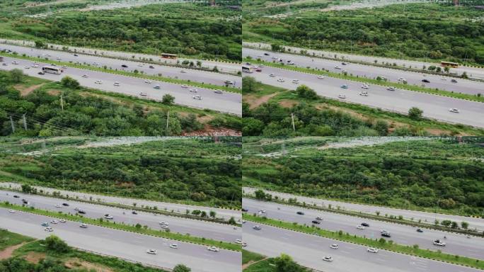 巴基斯坦高速公路上拥挤的道路上行驶的汽车、公共汽车和卡车的鸟瞰图