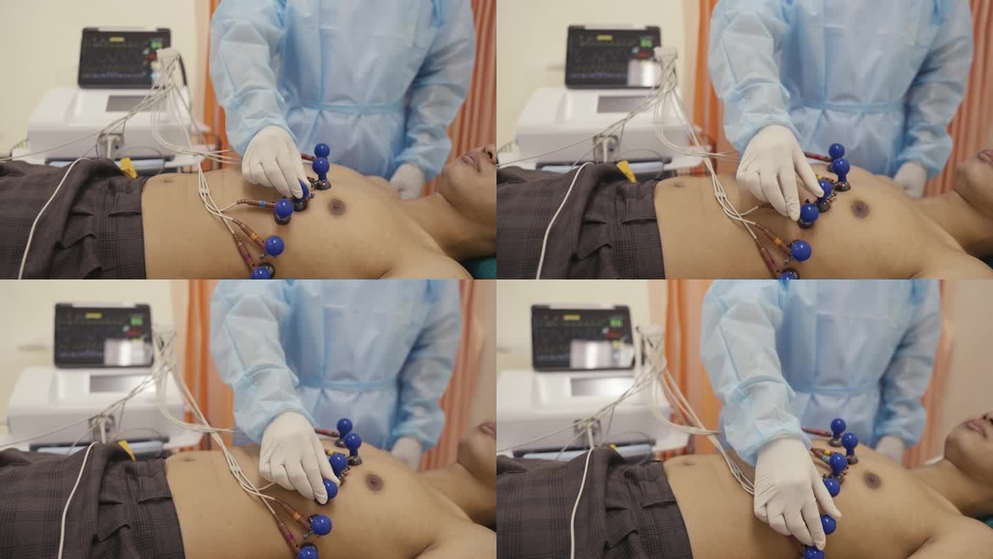 医院护士将电极固定在病人的四肢上，用于心脏病学测试和设备。医生正在为一名男性病人准备取心电图。医生把