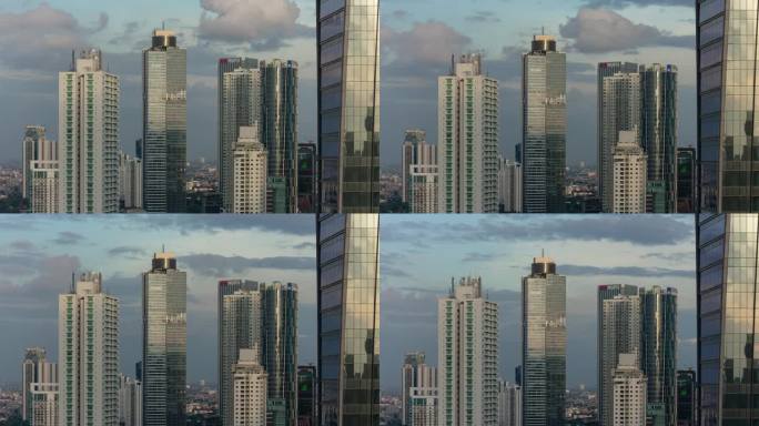 风暴天空日落时间雅加达市中心现代建筑屋顶全景4k延时拍摄印度尼西亚