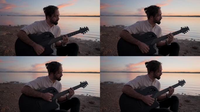 一个年轻人的剪影，坐在海边弹吉他
