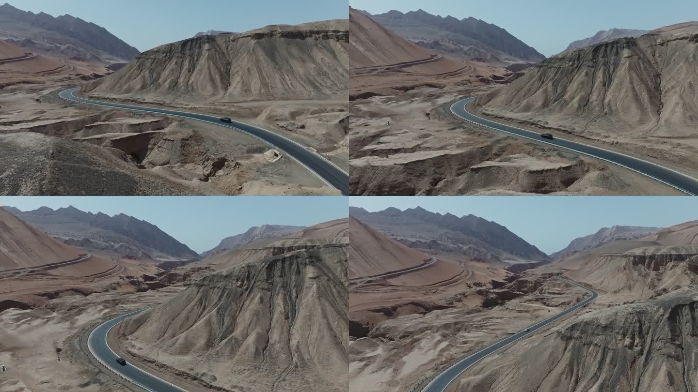 吐鲁番火焰山下吐峪沟沙漠上越野行驶的车