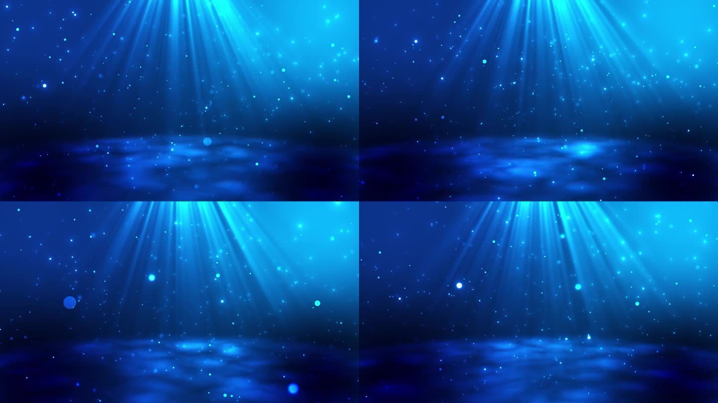 抽象的蓝色粒子背景。美丽的浪花和飞舞的发光粒子，雨滴的点点。美丽的散景。聚光灯或光线