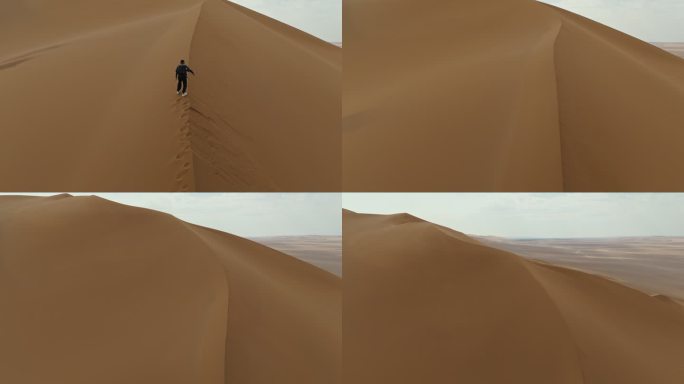库木塔格沙漠上徒步的人爬沙山爬沙漠爬沙丘