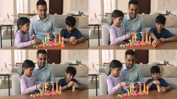 慈爱的印度父亲和孩子们一起玩积木