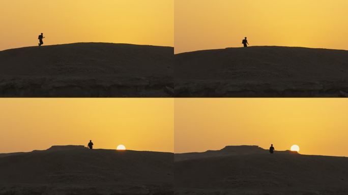 新疆哈密大海道雅丹风蚀地貌夕阳下奔跑的人