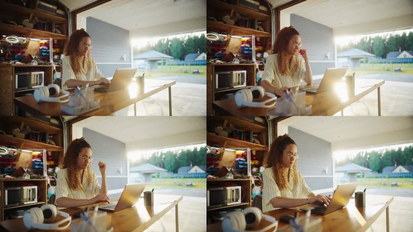 年轻的西班牙裔女性软件开发人员在开放的车库用笔记本电脑编程。一位女士经营着一家为企业提供创新SaaS