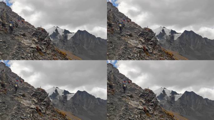 攀登横断山脉乌库楚雪山的登山者徒步进山