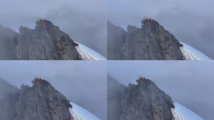 航拍登顶横断山脉乌库楚雪山的登山者