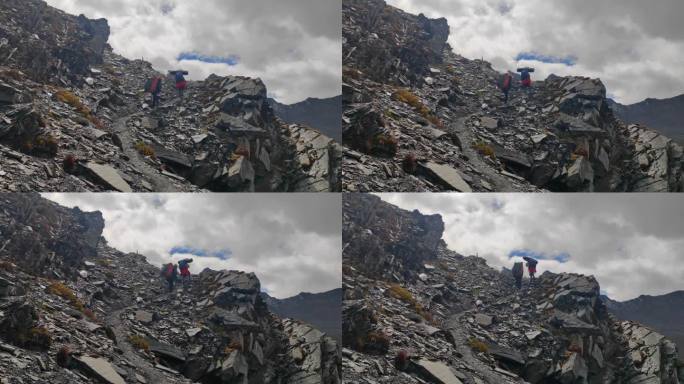 攀登横断山脉乌库楚雪山的登山者徒步进山