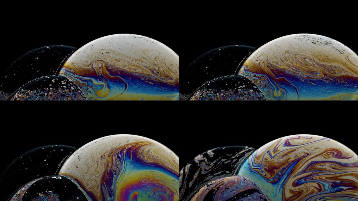 旋转的泡泡团充满了旋转的彩色油漆，就像一个行星抽象的背景