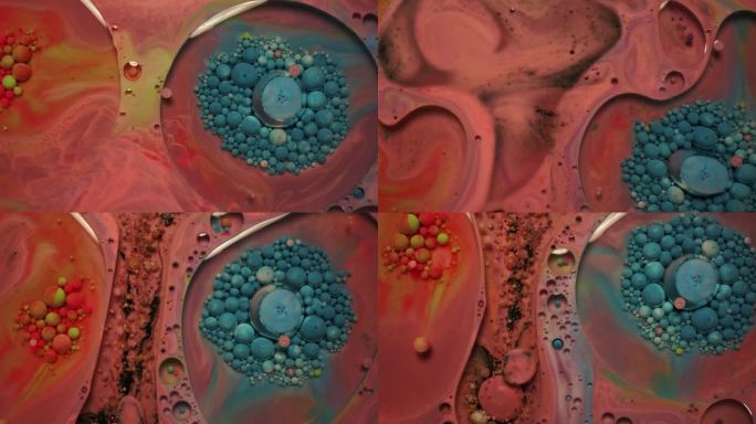 彩虹泡泡的油漆和墨水在水中。五颜六色的液体旋转并混合在一起