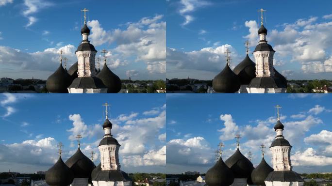 天空多云的背景下，带有黑色圆顶的东正教教堂航拍图