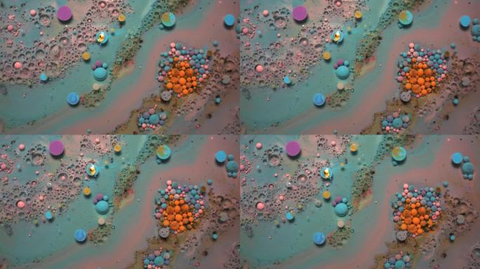 彩虹泡泡的油漆和墨水在水中。彩色液体在一起旋转