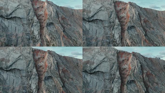 南蒂罗尔Pederü惊人的山壁特写，展示了蓝天下独特的岩层。